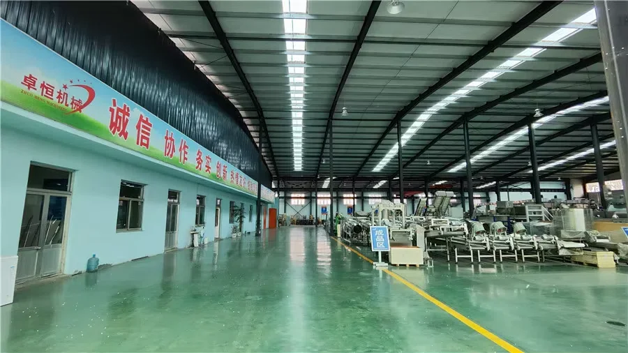 Food processing equipment inside the Zhuoheng machinery workshop in Jinan
